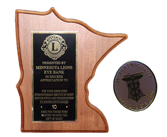 Plaque and pin for volunteer enucleators